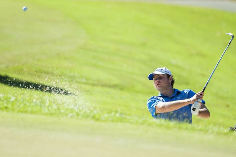 Devyn Pappas of Valley View blasts a shot out of a bunker Thursday during the boys Overall championship at Pleasant Valley Country Club in Little Rock. For more photos, go to arkansasonline.com/1018stategolf/.