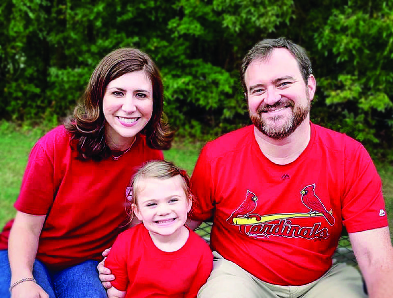 Brooke and Kyle Bridges and their daughter, 4-year-old Grace, support the St. Louis Cardinals. Soon after Brooke and Kyle met, she showed up at his place to watch the game wearing a red shirt and carrying dinner. “That’s when I knew Brooke was the one,” he says. 