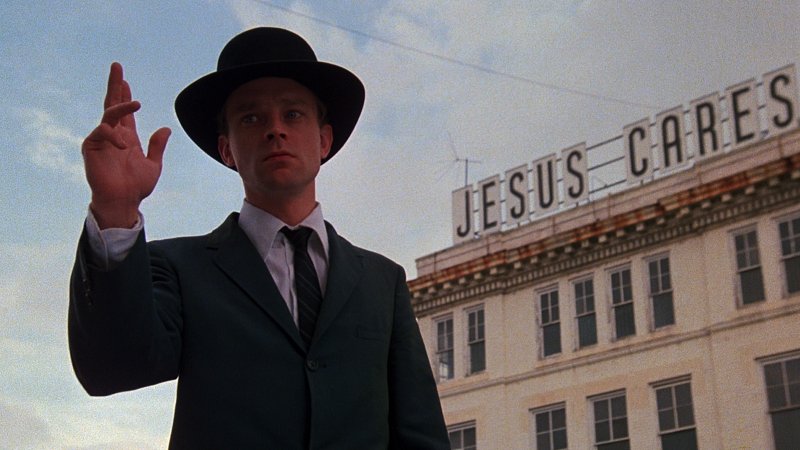 Hazel Motes (Brad Dourif) is a returning war veteran who founds his own church in John Huston’s 1979 film of Flannery O’Connor’s novel Wise Blood. A documentary on O’Connor’s life and work kicks off the Hot Springs Documentary Film Festival tonight. 