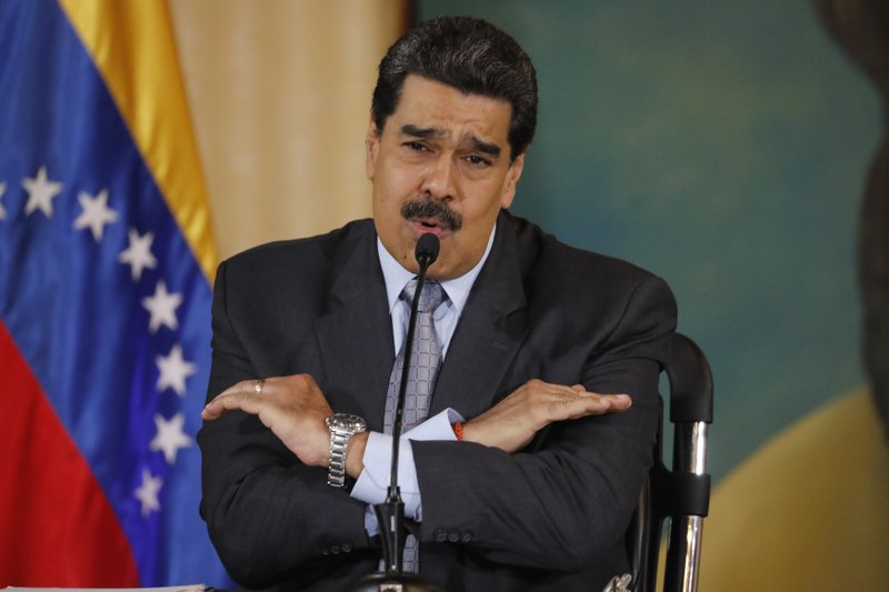 FILE - In this Sept. 30, 2019, file photo, Venezuela's President Nicolas Maduro speaks during a press conference at the Foreign Ministry in Caracas, Venezuela. The Venezuelan ambassador to Japan says his bank account has become inaccessible in Japan in what he said was apparently a consequence of President Donald Trump&#x2019;s decision to freeze Venezuelan assets in the United States. The Trump administration has sought to isolate Venezuelan President Nicolas Maduro by prohibiting high-ranking loyalists from entering the U.S. and by freezing U.S. assets of many included in the no-entry list. (AP Photo/Ariana Cubillos, File)