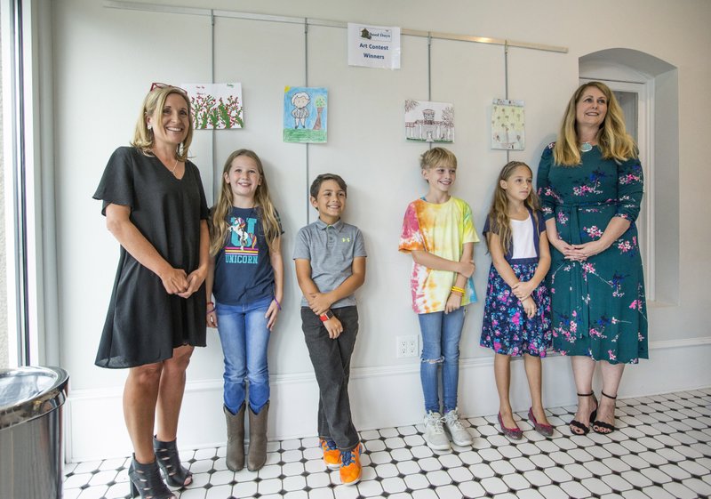 Stephanie Orman (from left), Bentonville Mayor, award winners Bailey Spackman, Sawyer Hanson, Pennelope Pettigrew and Ella Marie Sidlow, and Debra Layton, executive director of the Peel Compton Foundation, pose for a photo Wednesday, Oct. 9, 2019, during the awards ceremony for the School Days Art Contest at The Peel Mansion and Heritage Gardens in Bentonville. Students who visited the mansion in September as part of the annual School Days learned about life in the 1800's and were encouraged to create art inspired by their visit.