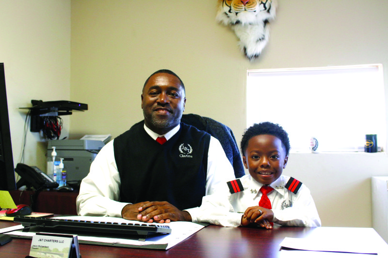 J&T Charters owner and president Jason Richardson, left, and vice president Jason Richardson II sit in their office Friday. A ribbon-cutting for the business was held yesterday afternoon.