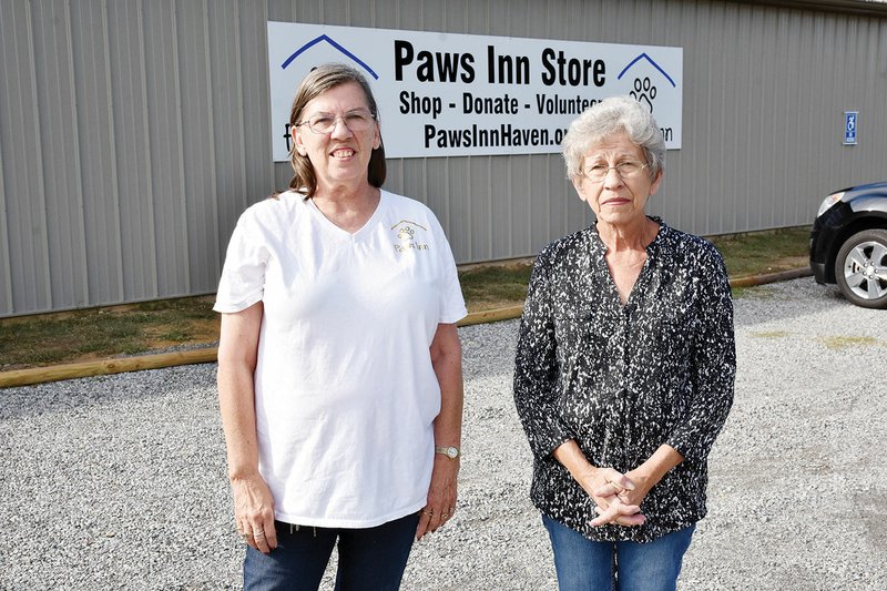 Paws Inn Inc. committee president Theresa Martin, left, and vice president Betty Harris stand outside the organization’s new thrift store, which opened earlier this month. Paws Inn is raising money to build a no-kill animal shelter in Searcy. The shelter will be built on the same property where the store is, 3754 Arkansas 367.