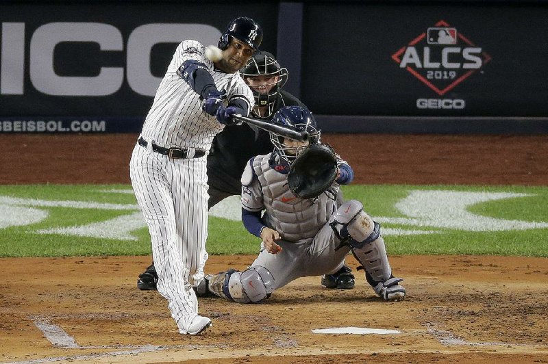Aaron Hicks of the New York Yankees connects on a three-run home run in the first inning of the Yankees’ victory over the Houston Astros in Game 5 of the American League Championship Series on Friday night.