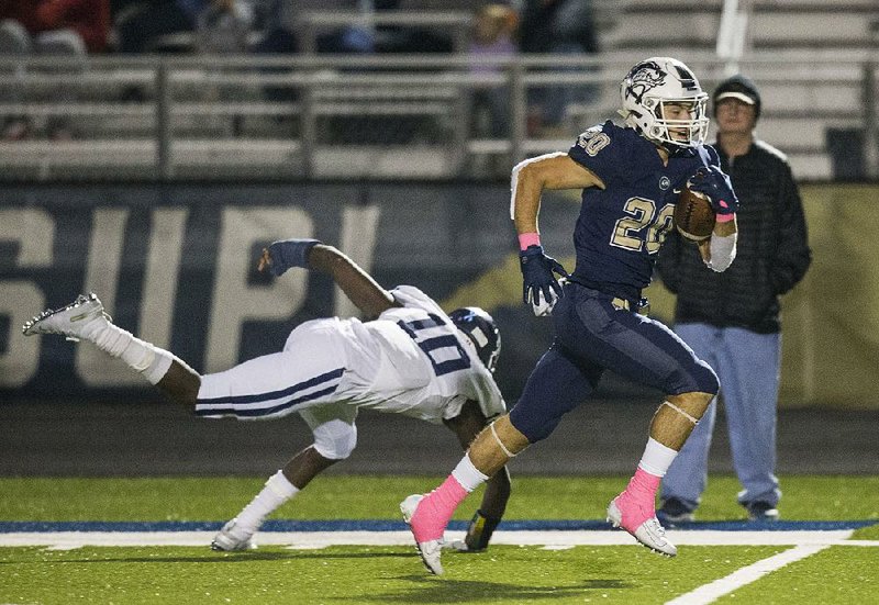 Bentonville West’s Nick Whitlatch breaks the tackle of Springdale Har-Ber’s J.B. Brown on a 62-yard touchdown run in the second quarter Friday at Wolverine Stadium in Centerton. Bentonville West won 24-20. More photos are available at arkansasonline.com/1019harber/