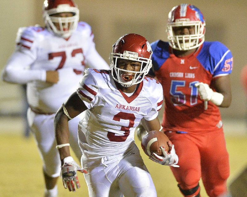 Texarkana receiver Torie Blair (3) runs by Little Rock McClellan defensive end Caleb Moore (51) on Friday during the Razorbacks’ 30-28 victory over the Lions in Little Rock. More photos are available at arkansasonline.com/1019mcclellan/.