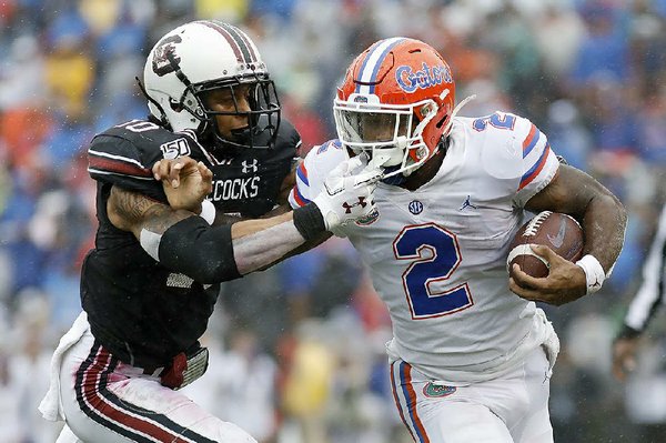 No. 9 Gators rally in 4th quarter behind Trask The Arkansas