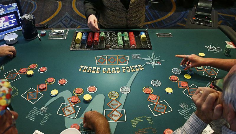 Players bet at poker tables in the casino at the WinStar World Casino and Resort in Thackerville, Okla., about 80 miles northwest of Dallas. 