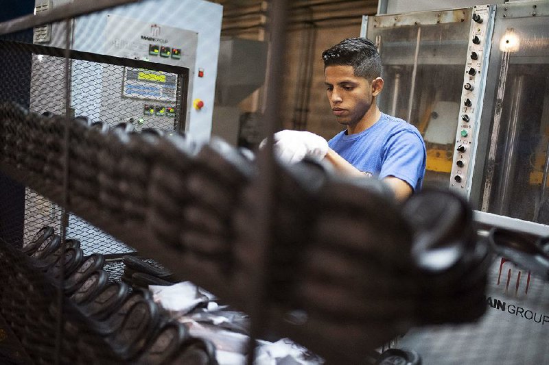 A worker sorts shoe soles at a factory in the industrial zone of Valencia, Carabobo state, Venezuela, in September. 