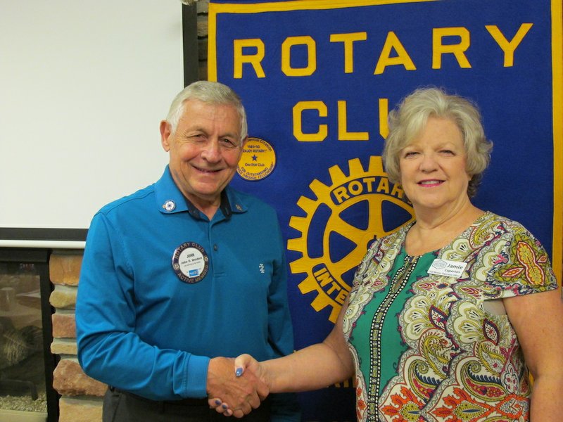 HSV Rotary President John Weidert, left, welcomes Jamie Caperton of the Hot Springs Village POA. - Submitted photo