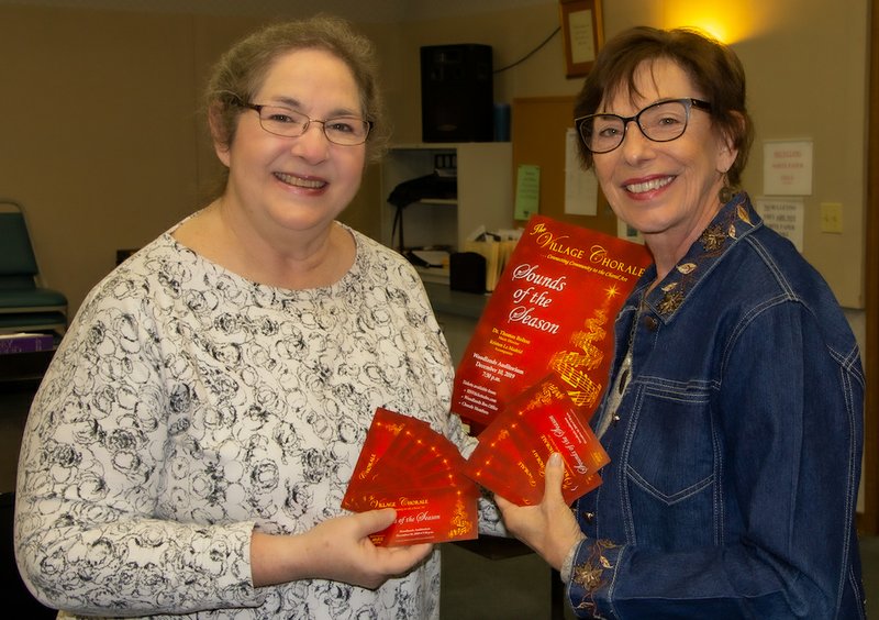 Diane Upchurch, left, ticket chair, and Janelle Esch, vice president, show the tickets for the Chorale's Christmas Concert. - Submitted photo