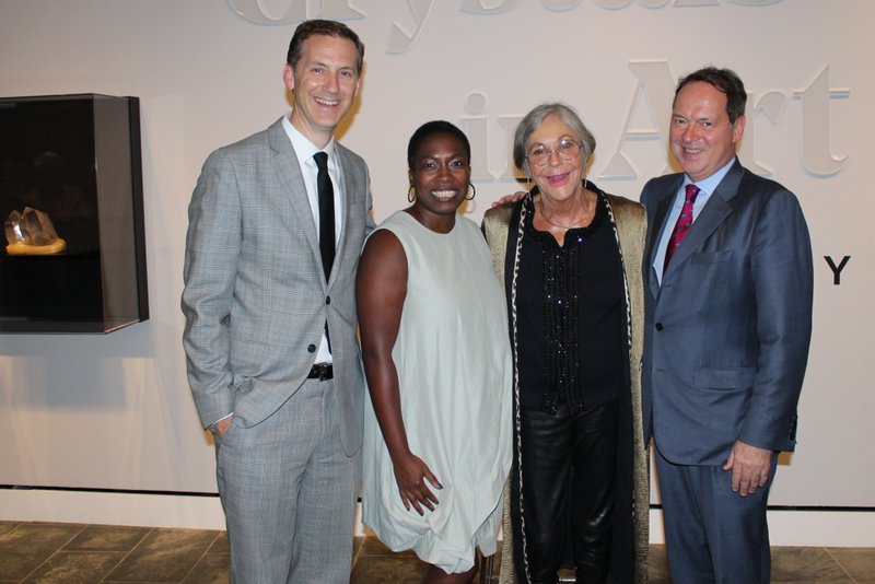 NWA Democrat-Gazette/CARIN SCHOPPMEYER Alice Walton, Crystal Bridges Museum of American Art founder and board chairwoman (third from left), welcomes patrons to the Oct. 10 preview of Crystals in Art: Ancient to Today with Rod Bigelow, the museum's executive director and chief diversity and inclusion officer (from left); Lauren Haynes, curator of contemporary art; and Joachim Pissarro, Hunter College Galleries director and Crystals co-curator.