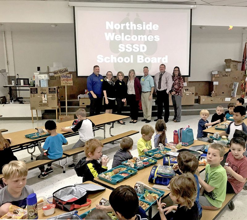 Janelle Jessen/Siloam Sunday School board members ate lunch with Northside Elementary School students on Tuesday before a tour of the school. School board members plan to have lunch and tour a different school each month. Pictured are Travis Jackson, board member (left); Connie Matchell, board member; Audra Farrell, board member; Michelle Paden, principal; Brian Lamb, school board president; Jody Wiggins, superintendent; and Amy Carter, assistant superintendent.