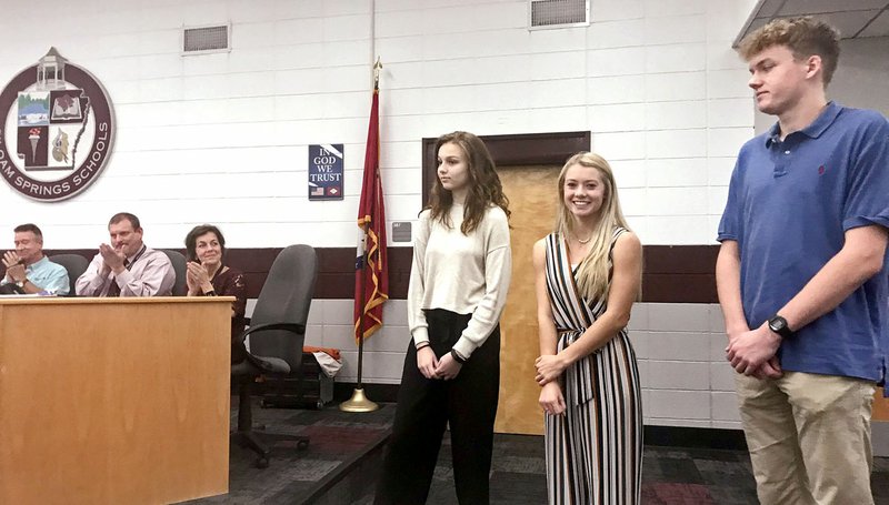 Janelle Jessen/Siloam Sunday School board members recognized students Katherine Arrington (left), Emma Hulbert and Mason Cooper during Tuesday's meeting for being named 2020 National Merit Scholarship Semifinalists.