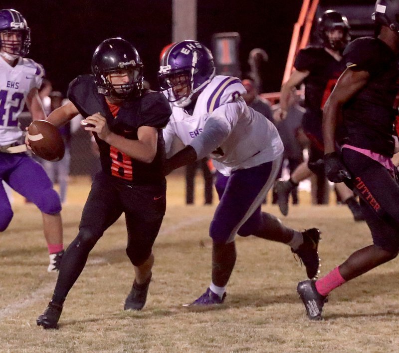 Cutter Morning Star's Sam Moore (8) looks for running room as England's Marvin Shavers (0) defends during action at Eagle Field Friday. Photo by Richard Rasmussen of The Sentinel-Record