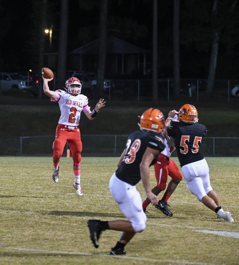 The Sentinel-Record/Grace Brown GET UP: Mountain Pine quarterback Collin Smith (2) jumps up to pass to a teammate during Friday's game at Magnet Cove. The Panthers won, 35-26.