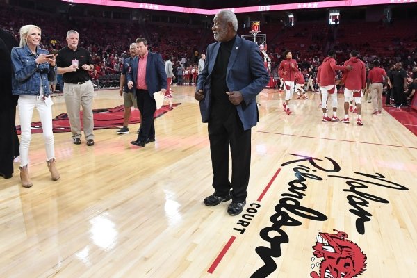 Former head coach for the Razorbacks basketball team Nolan Richardson poses for photos Sunday, Oct. 20, 2019, after the court at Bud Walton Arena in Fayetteville was named after Richardson. The court will now be known as Nolan Richardson Court.
