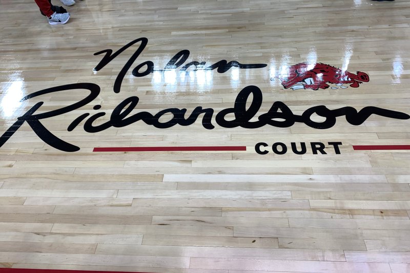 The logo for Nolan Richardson Court at Bud Walton Arena is shown Sunday, Oct. 20, 2019, prior to a game between Arkansas and Arkansas-Little Rock in Fayetteville. 