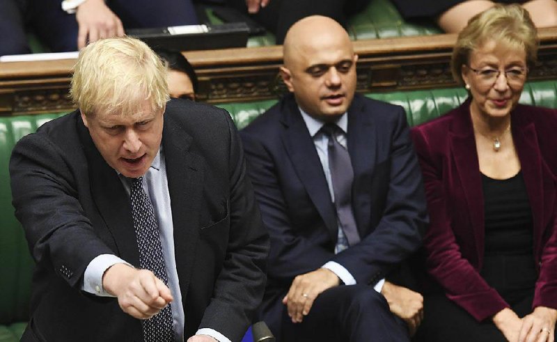 British Prime Minister Boris Johnson tries unsuccessfully to get approval for his Brexit plan Saturday in the House of Commons during the first Saturday session of Parliament since the Falklands War in 1982. More photos at arkansasonline.com/1020brexit/ 