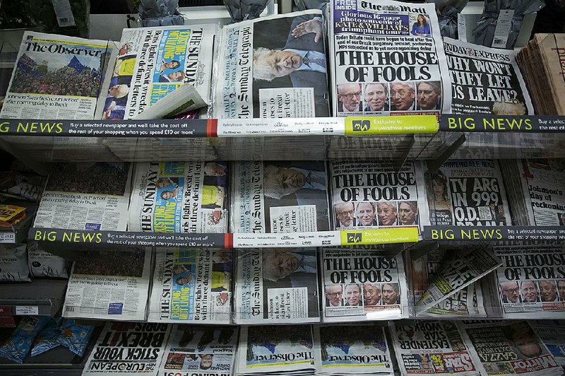 British national newspapers on sale at a supermarket in Surbiton, southwest London, show their Brexit-related front pages. 