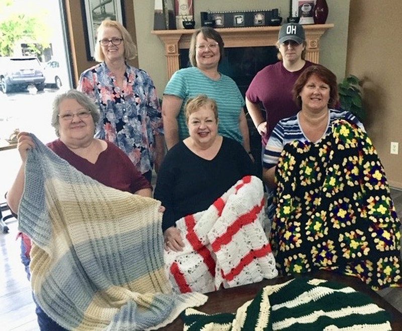 Fiber Therapy Extension Homemakers Club has knitted and crocheted over 50 afghans this year for hospice patients, providing warmth and comfort during their time of need, a news release said. The afghans have been distributed through Hospice of Central Arkansas and Arkansas Hospice. "It is our pleasure to gift these patients with a blanket handmade by a member of our club and we hope each recipient enjoyed their afghan as much as we enjoyed making it for them," President Anna Jackson said. Standing, from left, are Rita Blackwood, Jackson and Ceci McFee and seated, from left, are Pat Blankenship, Amy Thomason with Arkansas Hospice, and Tiffany Cooper. - Submitted photo