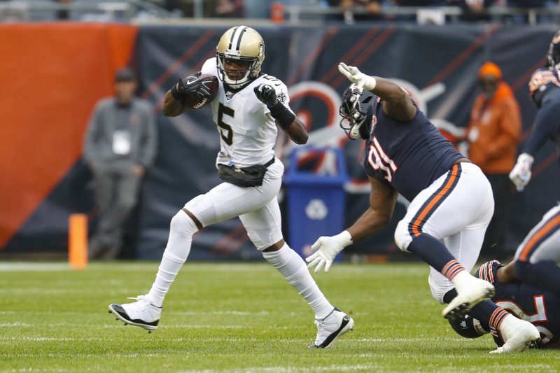 The Associated Press CHASED BY A BEAR: New Orleans Saints quarterback Teddy Bridgewater (5) is chased by Chicago Bears nose tackle Eddie Goldman (91) during the first half of Sunday's game in Chicago.