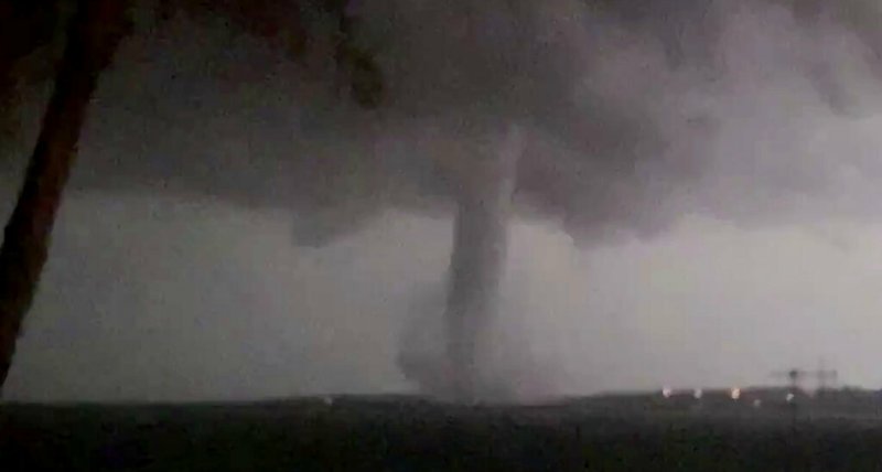 This Oct. 20, 2019 image made from video by Twitter user @AthenaRising shows the tornado in Rockwall, TX. The National Weather Service confirmed a tornado touched down in Dallas on Sunday night, causing structural damage and knocking out electricity to thousands. (@AthenaRising via AP)