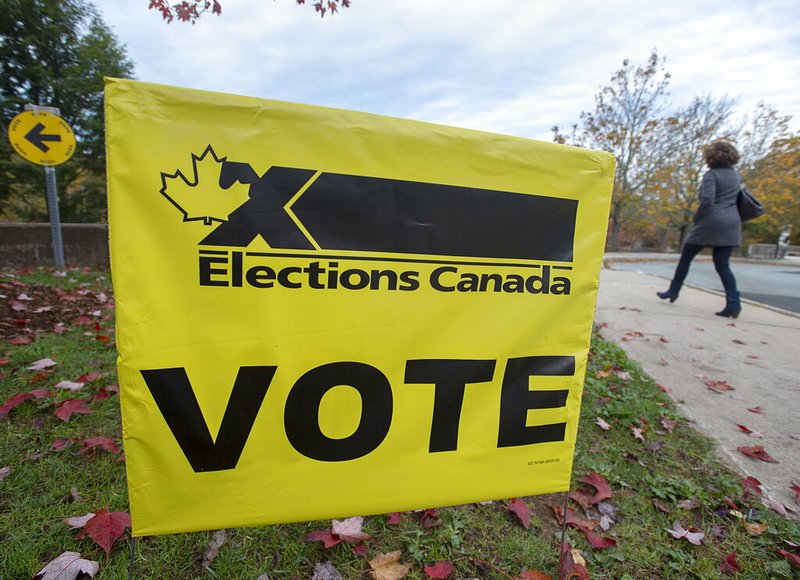 A voter heads to cast their vote in Canada's federal election at the Fairbanks Interpretation Centre in Dartmouth, Nova Scotia, Monday, Oct. 21, 2019. (Andrew Vaughan/The Canadian Press via AP)