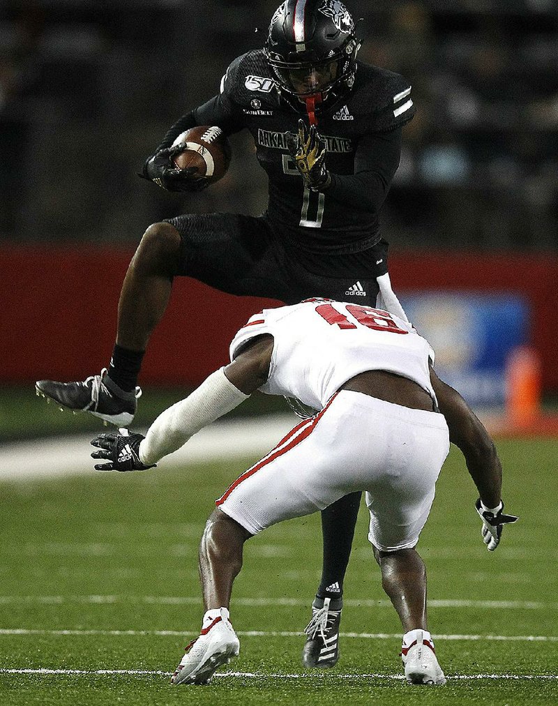 Louisiana-Lafayette forced Arkansas State into more running looks and played tighter coverage on ASU’s big-play receivers, Omar Bayless (above) and Kirk Merritt, on Thursday. 