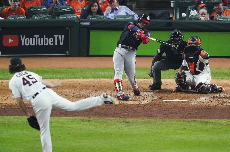Juan Soto of the Washington Nationals connects off Houston Astros pitcher Gerrit Cole for a home run during the fourth inning of the Nationals’ victory in Game 1 of the World Series on Tuesday night in Houston. Soto also had a two-run double in the fifth inning.