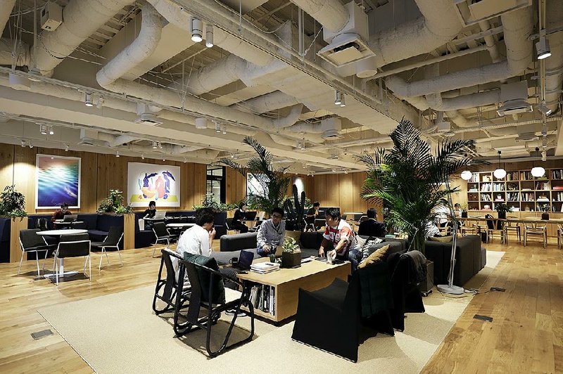 People work in a WeWork co-working office space, operated by The We Co., earlier this month in Yokohama, Japan.