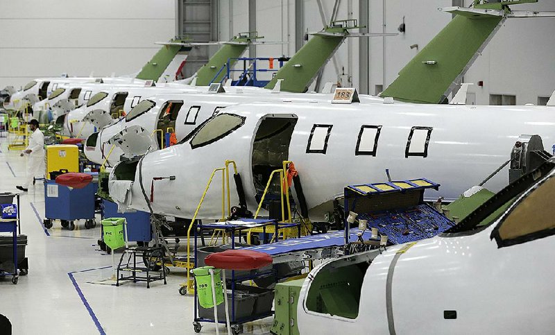 Workers assemble HondaJet Elite aircraft last summer in the main production area at the Honda Aircraft Co. headquarters in Greensboro, N.C.