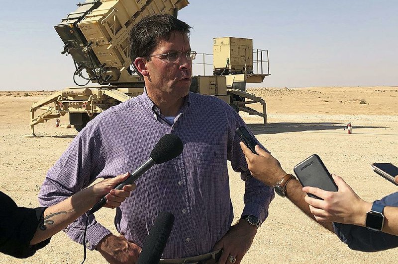 Defense Secretary Mark Esper speaks Tuesday with reporters at Saudi Arabia’s Prince Sultan Air Base after touring a U.S.-made Patriot missile battery. 