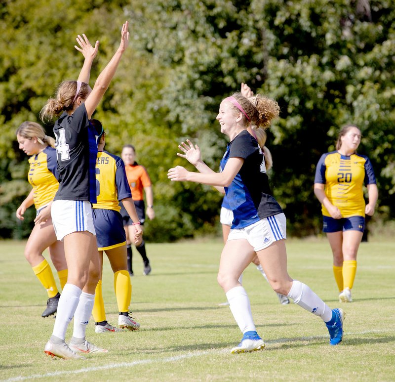 Photo courtesy of JBU Sports Information John Brown sophomore Megan Hutto, right, celebrates with a teammate after scoring a goal against Wayland Baptist last Saturday.