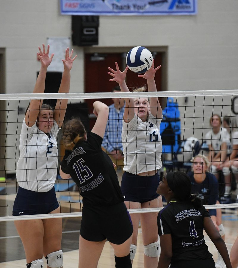 NWA Democrat-Gazette/J.T. WAMPLER Springdale Har-Ber's Kat Cooper (15) blocks a shot by Fayetteville's Amelia Whatley Tuesday Oct. 22, 2019. Har-Ber won the match 3-0 and will be the No. 2 seed from the 6A-West and Fayetteville will be the No. 3 seed in next week's state tournament.