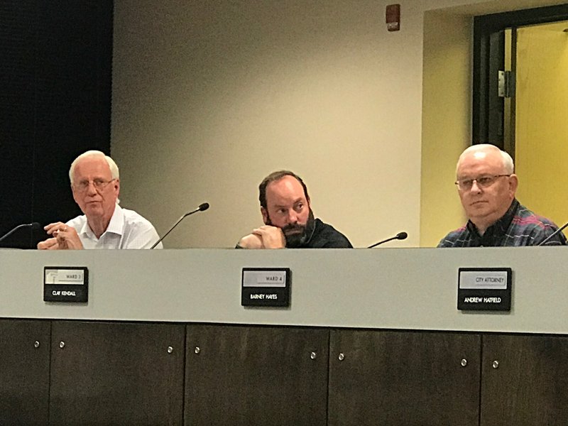 NWA Democrat Gazette/ALEX GOLDEN Rogers City Council members Gary Townzen, Clay Kendall and Barney Hayes consider items Tuesday during a council meeting.