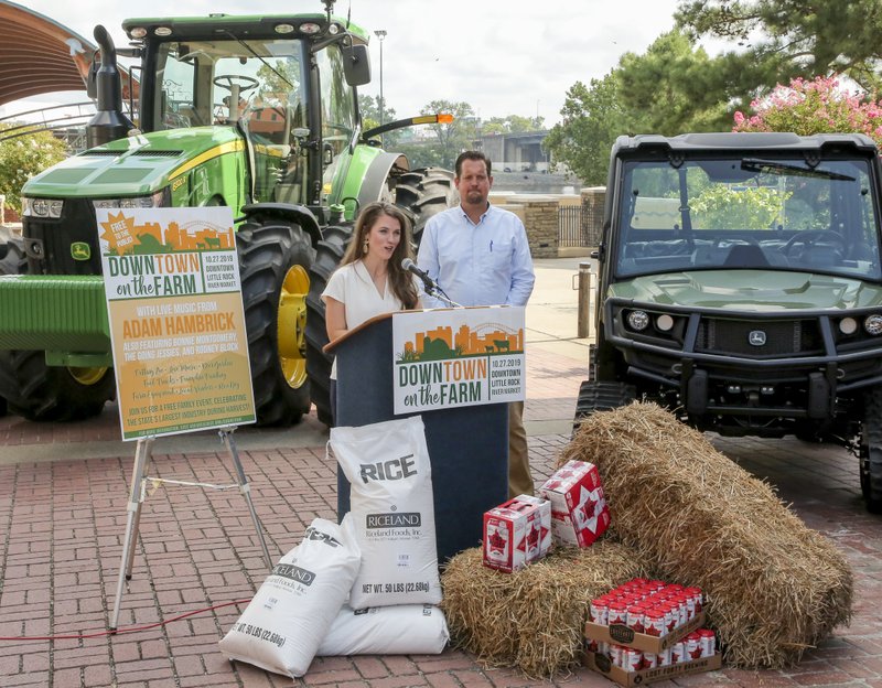 In July, Lauren Waldrip and Gabe Holmstrom brought bags of Arkansas rice, bales of hay, beer and tractors to announce their new venture, Downtown on the Farm, scheduled for Sunday in Little Rock. Democrat-Gazette file photo/John Sykes Jr.