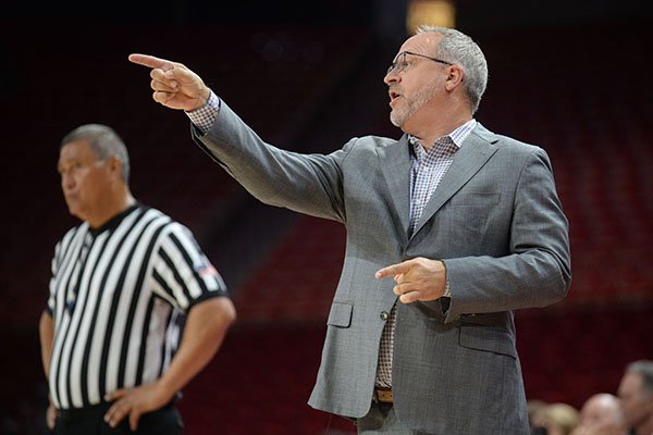 Arkansas coach Mike Neighbors directs his players against Pittsburg State Thursday, Oct. 24, 2019, during the second half of play in Bud Walton Arena.