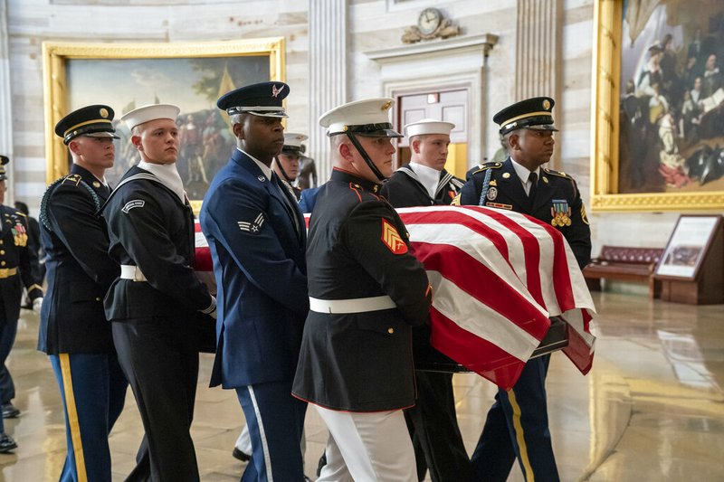 The late Maryland Rep. Elijah Cummings is carried through the Rotunda of the Capitol to lie in state at the Capitol in Washington, Thursday, Oct. 24, 2019. The Maryland congressman and civil rights champion died Thursday, Oct. 17, at age 68 of complications from long-standing health issues. (AP Photo/J. Scott Applewhite)