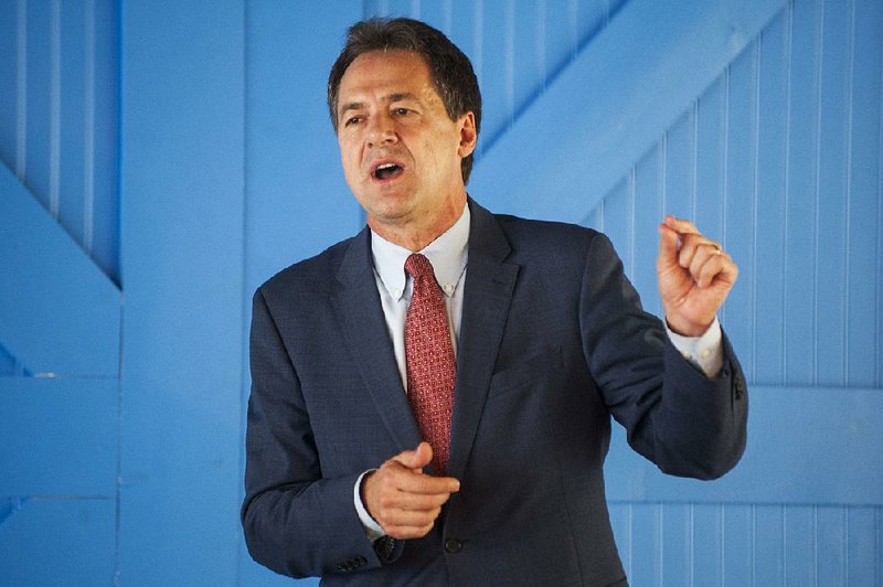 Montana Gov. Steve Bullock, who is a Democratic presidential candidate, talks during a fundraiser Thursday at Red & Blue events venue in Little Rock. Bullock took a break from campaigning in Iowa to come to Arkansas. 