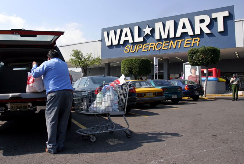 A customer loads his vehicle outside a Wal-Mart store in Mexico City in this file photo.
