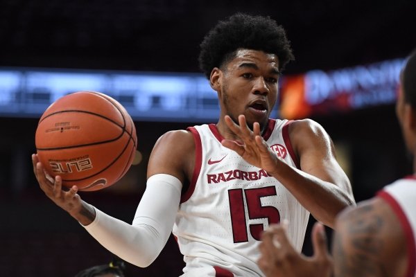Arkansas' Mason Jones looks to pass to Reggie Chaney against Southwestern Oklahoma State on Friday, Oct. 25, 2019 at Bud Walton Arena.