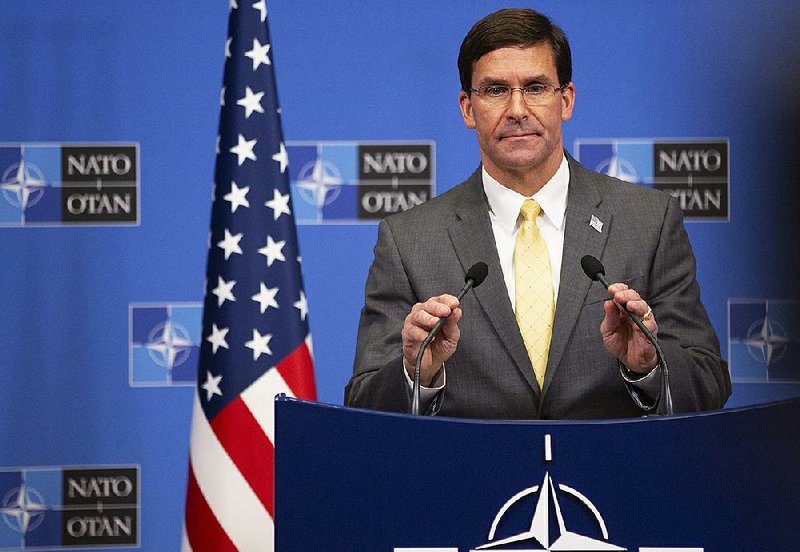 Defense Secretary Mark Esper said Friday in Brussels that while the overall U.S. withdrawal from Syria would continue, troops, including “some mechanized forces,” would remain in eastern Syria to protect oil fields. More photos at arkansasonline.com/1026troops/ 