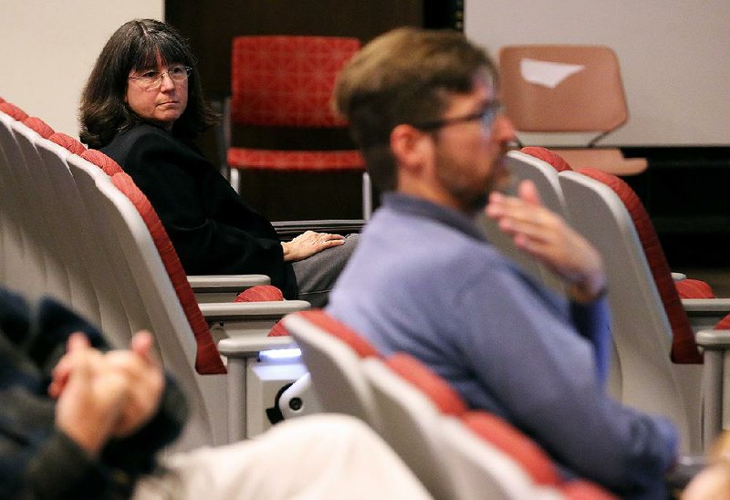 FILE — University of Arkansas at Little Rock chancellor Christina Drale (left) listens to faculty members express concerns during the UALR Faculty Senate Meeting on Friday, Oct. 25, 2019. 