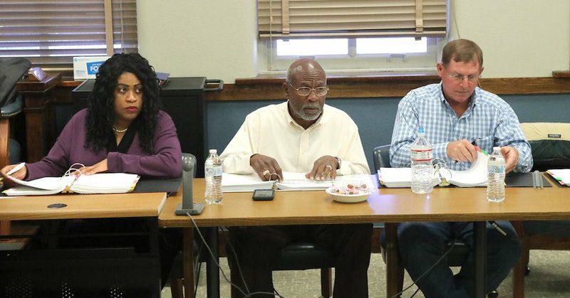 From left, Justices of the Peace Esther Dixon, D-District 3, Thomas Anderson, D-District 2, and Ronald Hunter, R-District 11, listen to the county's 2020 budget proposals during Wednesday's hearing in the County Courtroom. - Photo by Richard Rasmussen of The Sentinel-Record