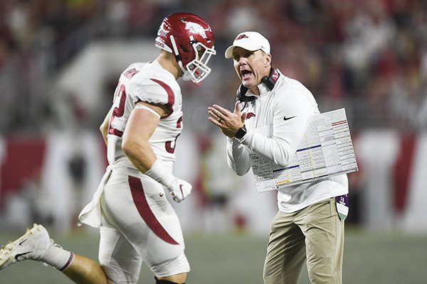 Arkansas coach Chad Morris claps as fullback Hayden Johnson (32) runs off the field during a game against Alabama on Saturday, Oct. 26, 2019, in Tuscaloosa, Ala.