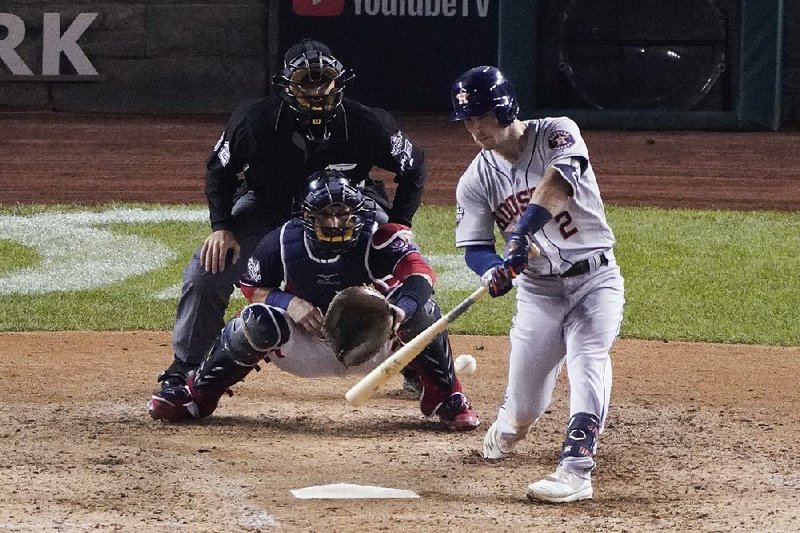 Houston’s Alex Bregman hits a grand slam during the seventh inning of Game 4 of the World Series against the Washington Nationals on Saturday in Washington. Bregman finished 3 for 5 with 5 RBI and 1 run in the Astros’ 8-1 victory.