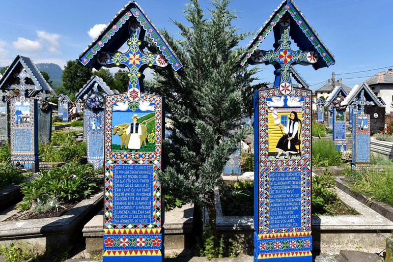 Romania's colorful Merry Cemetery celebrates its dead with poetry and stylized portraits. (Photo by Cameron Hewitt via Rick Steves' Europe)