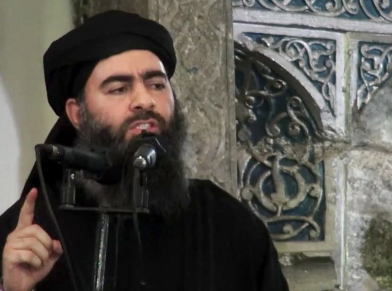FILE - This file image made from video posted on a militant website Saturday, July 5, 2014, purports to show the leader of the Islamic State group, Abu Bakr al-Baghdadi, delivering a sermon at a mosque in Iraq during his first public appearance. The leader of the Islamic State militant network is believed dead after being targeted by a U.S. military raid in Syria. A U.S. official told The Associated Press late Saturday, Oct. 26, 2019, that Abu Bakr al-Baghdadi was targeted in Syria&#x2019;s Idlib province. (AP Photo/Militant video, File)
