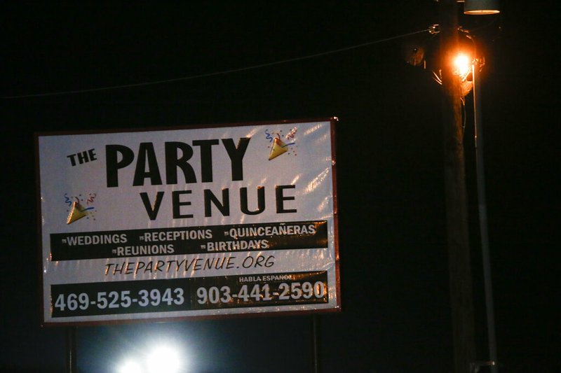 A sign is seen at a crime scene after a shooting at Party Venue on Highway 380 in Greenville, Texas, on Sunday, Oct. 27, 2019. 